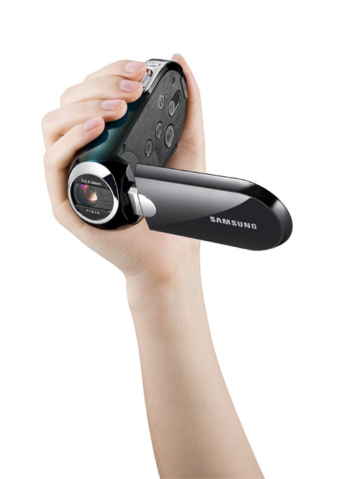 The Samsung SMX-C14 SMX-C10 video cameras are held at an angle for comfort